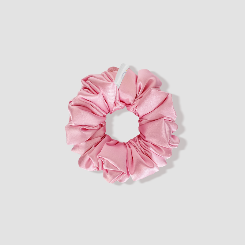 This is a picture of our petite/small baby pink satin scrunchie named Pinku. The elastic is 8 to 9 inches around. Fun Fact: Pinku means Pink in Japanese.