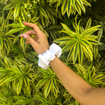 Picture of the white scrunchie on the wrist