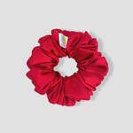 This is a picture of our red scrunchie named Rojo. It is a nice red color. The elastic is 8 to 9 inches around. Fun Fact: Rojo means red in Spanish.