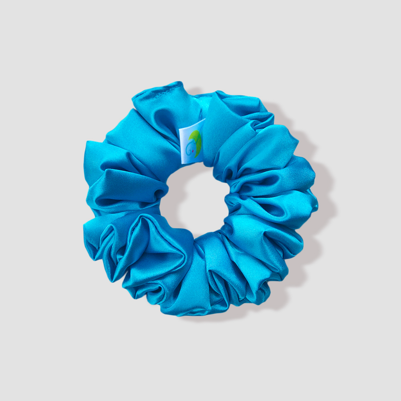This is a picture of our blue scrunchie named Azure. It is a rich blue color. The elastic is 8 to 9 inches around. Fun Fact: Azure means bright blue in color.