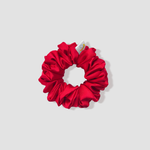This is a picture of our petite/small red scrunchie named Rojo. It is a nice red color. The elastic is 8 to 9 inches around. Fun Fact: Rojo means red in Spanish.