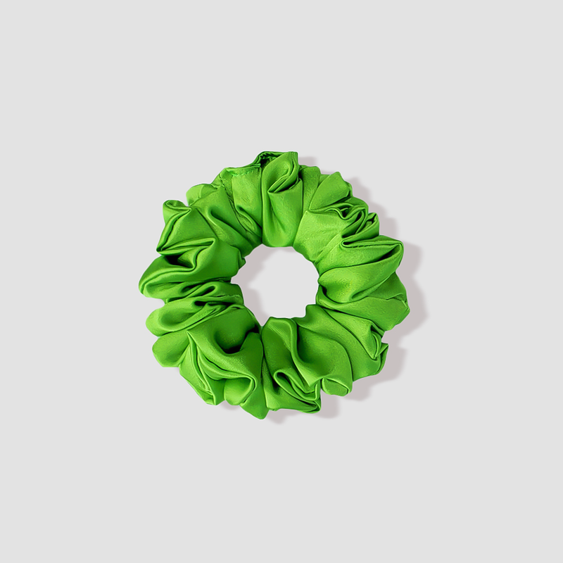 This is a picture of our petite/small bright green scrunchie named Zoro. It is a bold green color. The elastic is 8 to 9 inches around. Fun Fact: The name Zoro was inspired by the green hair of the character Zoro in One Piece.