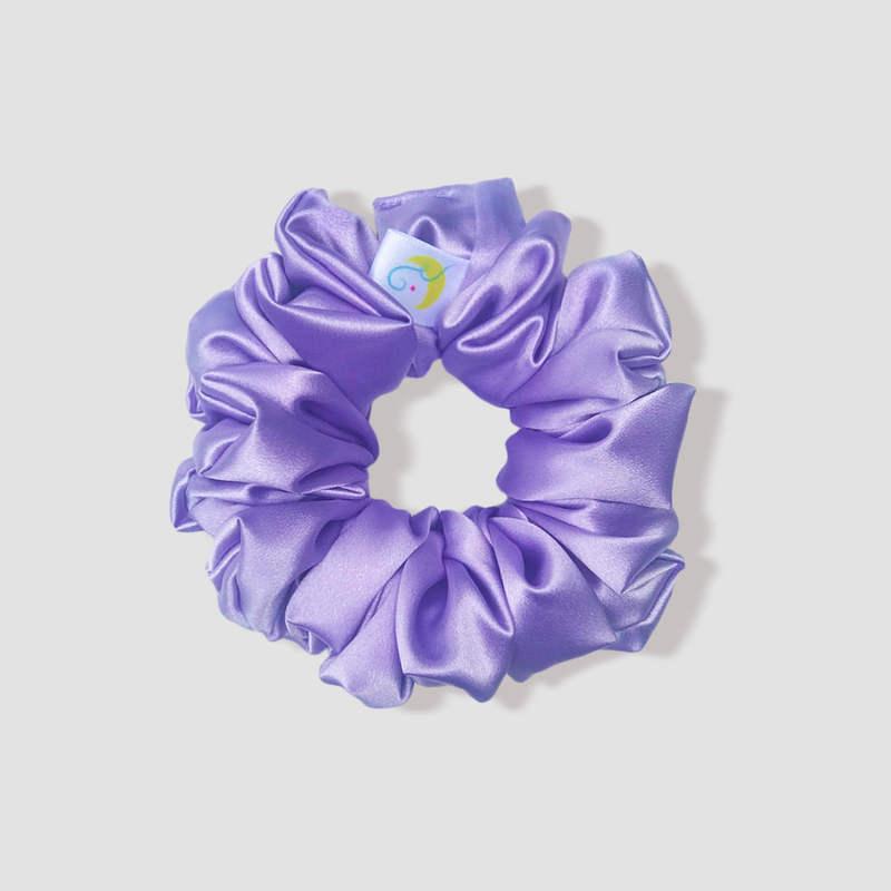 This is a picture of our lilac satin scrunchie named Lila. The color is a beautiful soft pastel purple. The elastic is 8 to 9 inches around. Fun Fact: Lila means Purple in Swedish.