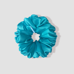 This is a picture of our Turquoise scrunchie named Turcoaz. It is a nice green-blue color. The elastic is 8 to 9 inches around. Fun Fact: Turcoaz means Turquoise in Romanian.