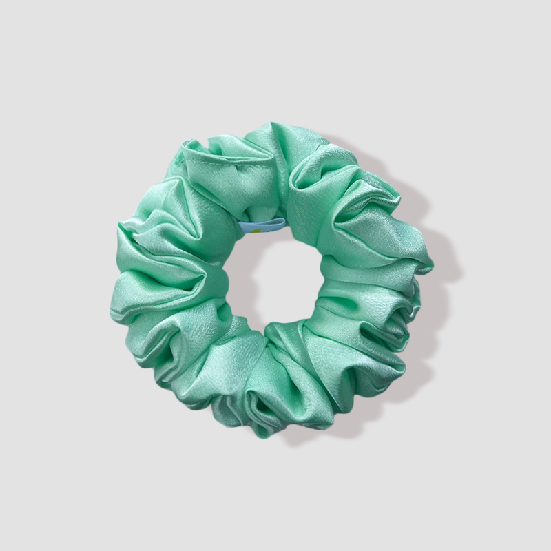 This is a picture of our mint green satin scrunchie named Minttu. The color is a beautiful light pastel green. The elastic is 8 to 9 inches around. Fun Fact: Minttu means mint in Finnish.