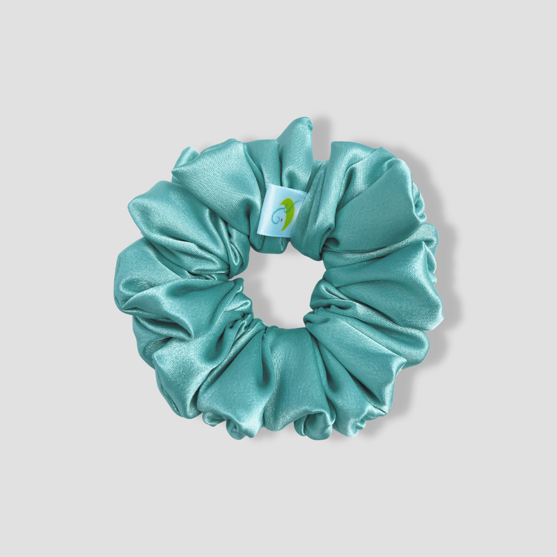 This is a picture of our light blue scrunchie named Bali. It is a pretty ocean blue color or seafoam. The elastic is 8 to 9 inches around. Fun Fact: The name was inspired by the island of Bali's beautiful water color ^-^