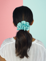 Picture of the light blue scrunchie in the hair.