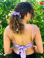 Picture of the Lilac colored scrunchie in the hair.