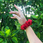 Picture of the Red scrunchie on the wrist