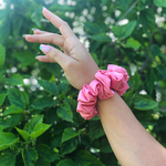 Picture of the Matte Pink scrunchie on the wrist 