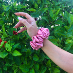 Picture of the Rose colored scrunchie on the wrist