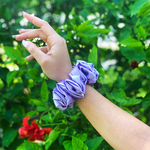 Picture of the Lilac colored scrunchie on the wrist