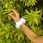 Picture of the white scrunchie on the wrist 
