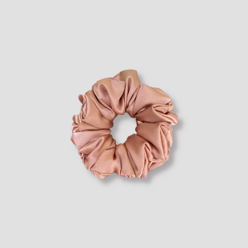 This is a picture of our small light brown satin scrunchie named Java. It is a nice earth tone, the perfect neutral color. The elastic is 8 to 9 inches around. Fun Fact: Java is a slang term for coffee.