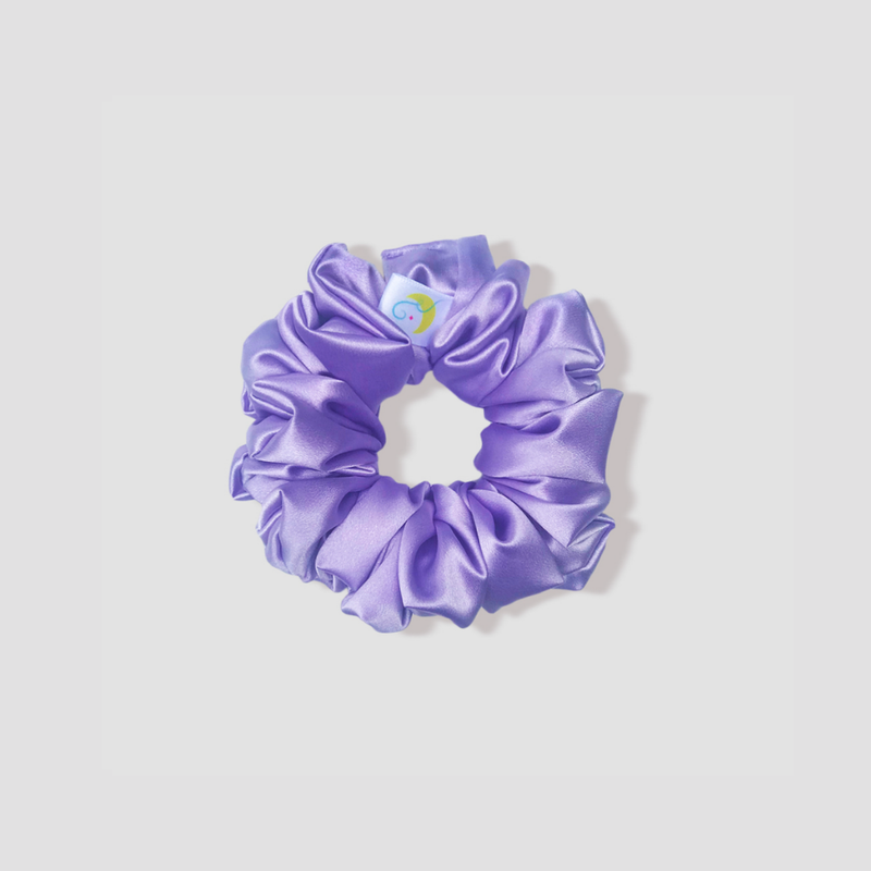 This is a picture of our petite/small lilac satin scrunchie named Lila. The color is a beautiful soft pastel purple. The elastic is 8 to 9 inches around. Fun Fact: Lila means Purple in Swedish.