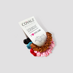 Picture of our skinny/extra small scrunchie pack. Colors shown are brown, pink, red, blue, and black. Some packs have a white scrunchie instead of either one of the aforementioned colors. Color combinations vary, and the item received will be random combination.